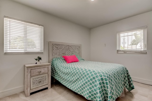 4727 Town N Country Blvd, Tampa, FL 33615 - bedroom featuring baseboards and a baseboard heating unit
