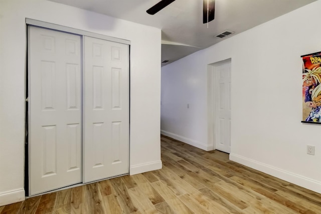 4727 Town N Country Blvd, Tampa, FL 33615 - unfurnished bedroom featuring light wood finished floors, a closet, and a ceiling fan