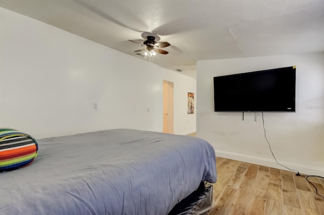 4727 Town N Country Blvd, Tampa, FL 33615 - bedroom with light wood-style floors and a ceiling fan