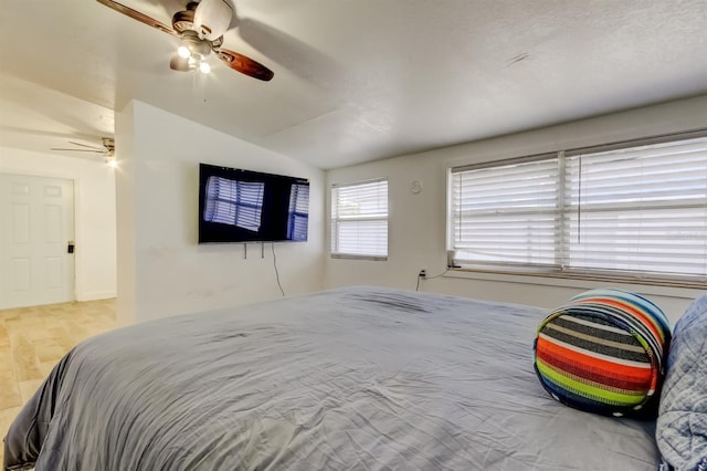 4727 Town N Country Blvd, Tampa, FL 33615 - bedroom with vaulted ceiling, ceiling fan, and wood finished floors