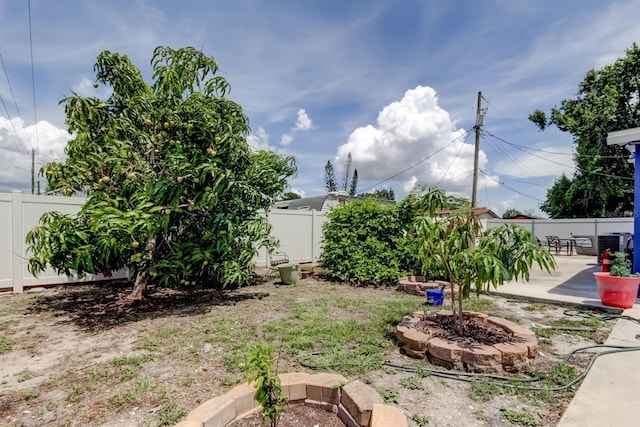 4727 Town N Country Blvd, Tampa, FL 33615 - fenced backyard with a patio and a fire pit