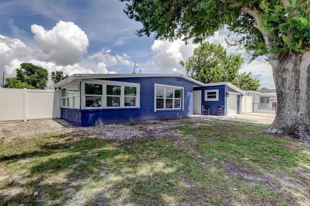 4727 Town N Country Blvd, Tampa, FL 33615 - back of property featuring an attached garage and driveway