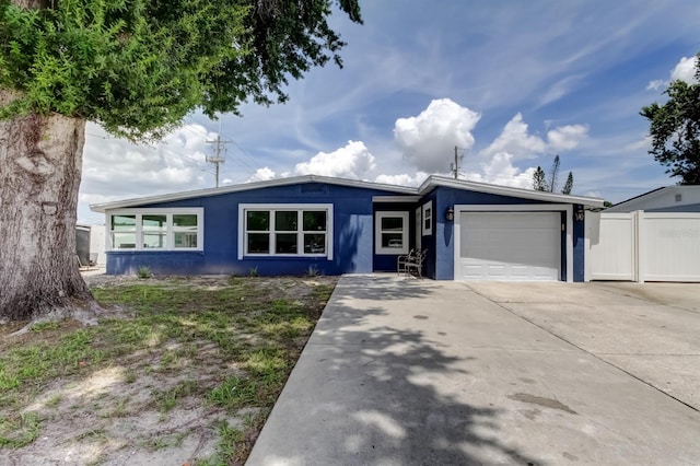 4727 Town N Country Blvd, Tampa, FL 33615 - view of front facade featuring an attached garage, concrete driveway, and stucco siding