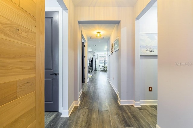 7683 Summerland Cv, Lakewood Ranch, FL 34202 - corridor with dark wood-type flooring and baseboards