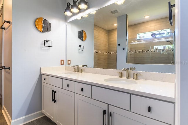 7683 Summerland Cv, Lakewood Ranch, FL 34202 - full bathroom with double vanity and a tile shower
