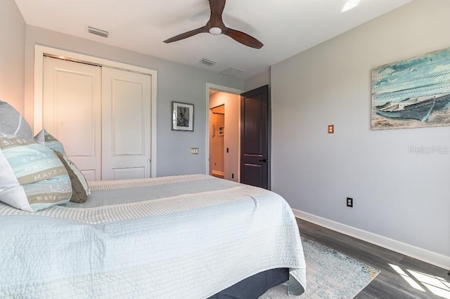 7683 Summerland Cv, Lakewood Ranch, FL 34202 - bedroom with dark wood-style flooring, a closet, and ceiling fan