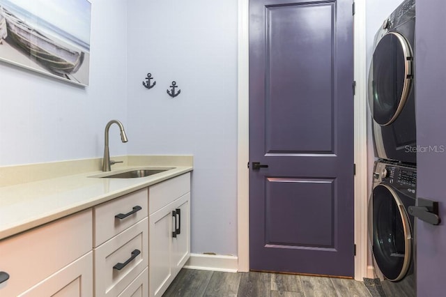7683 Summerland Cv, Lakewood Ranch, FL 34202 - washroom featuring stacked washer / dryer, cabinet space, and dark wood finished floors