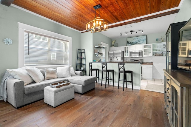 6016 N Dexter Ave, Tampa, FL 33604 - living room featuring a chandelier, wooden ceiling, hardwood / wood-style flooring, and crown molding
