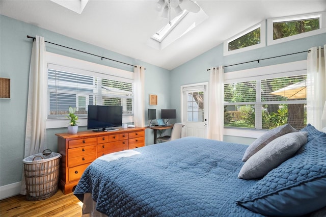 6016 N Dexter Ave, Tampa, FL 33604 - bedroom featuring a skylight, wood finished floors, and lofted ceiling