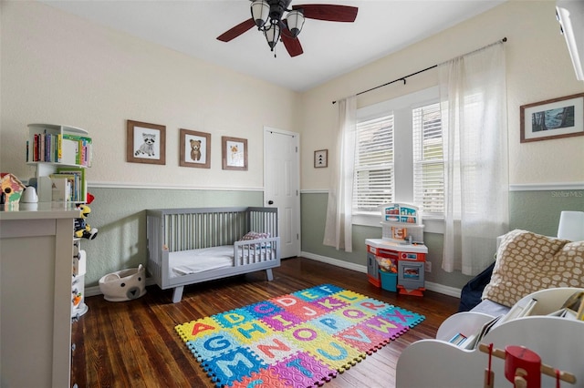 6016 N Dexter Ave, Tampa, FL 33604 - bedroom with hardwood / wood-style floors, a ceiling fan, and a textured wall