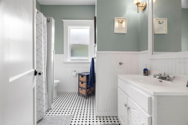 6016 N Dexter Ave, Tampa, FL 33604 - bathroom featuring wainscoting and vanity
