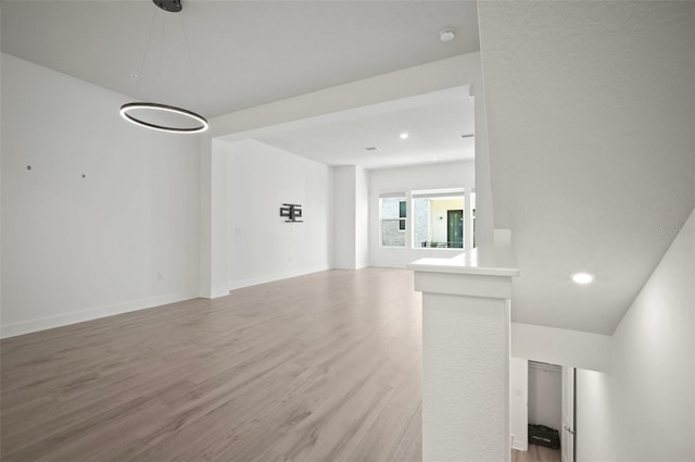 2511 N Grady Ave Unit 43, Tampa, FL 33607 - unfurnished living room with light wood-style flooring and recessed lighting