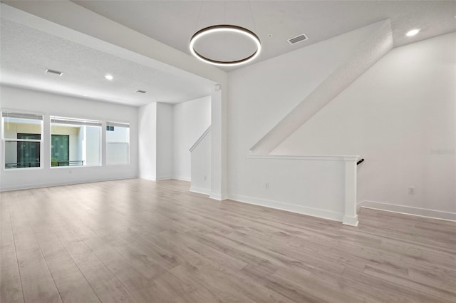 2511 N Grady Ave Unit 43, Tampa, FL 33607 - unfurnished living room with wood finished floors and recessed lighting