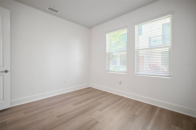 2511 N Grady Ave Unit 43, Tampa, FL 33607 - unfurnished room featuring wood finished floors and baseboards