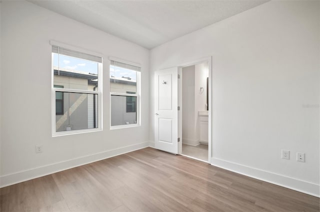 2511 N Grady Ave Unit 43, Tampa, FL 33607 - empty room featuring wood finished floors and baseboards
