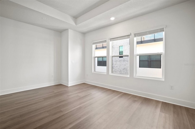 2511 N Grady Ave Unit 43, Tampa, FL 33607 - unfurnished room featuring dark wood-style flooring, healthy amount of natural light, and recessed lighting