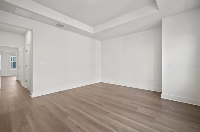 2511 N Grady Ave Unit 43, Tampa, FL 33607 - unfurnished room with a raised ceiling and wood finished floors