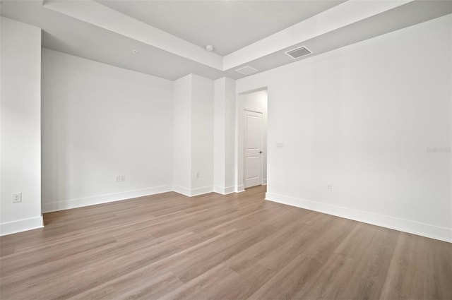 2511 N Grady Ave Unit 43, Tampa, FL 33607 - spare room featuring a tray ceiling and wood finished floors