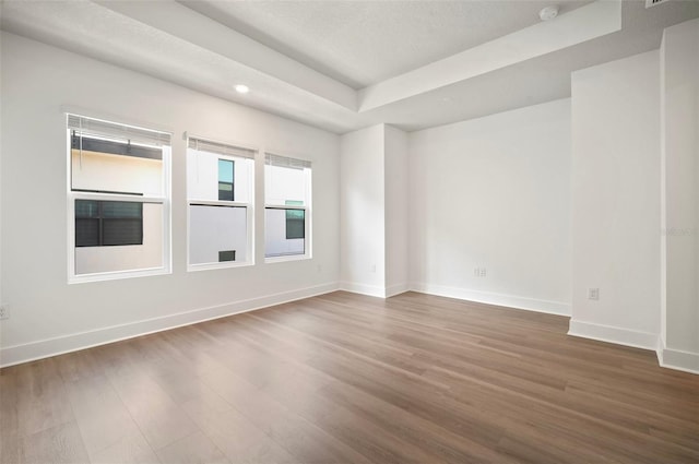 2511 N Grady Ave Unit 43, Tampa, FL 33607 - spare room with wood finished floors, recessed lighting, a smoke detector, a raised ceiling, and a textured ceiling