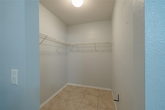 14524 Dunrobin Dr, Wimauma, FL 33598 - spacious closet featuring light tile patterned floors