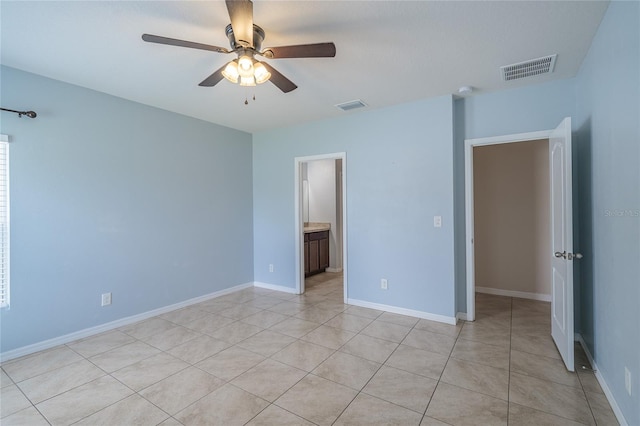 14524 Dunrobin Dr, Wimauma, FL 33598 - unfurnished bedroom with light tile patterned flooring and ceiling fan