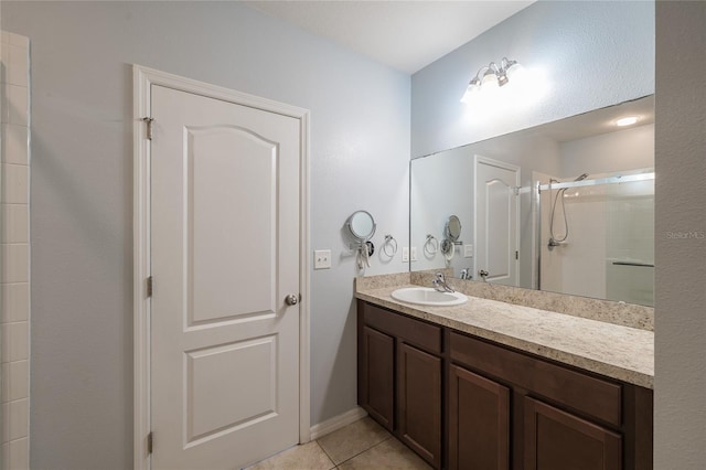 14524 Dunrobin Dr, Wimauma, FL 33598 - full bath featuring vanity, tile patterned flooring, and tiled shower