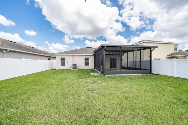 14524 Dunrobin Dr, Wimauma, FL 33598 - back of property with a sunroom, a fenced backyard, and stucco siding