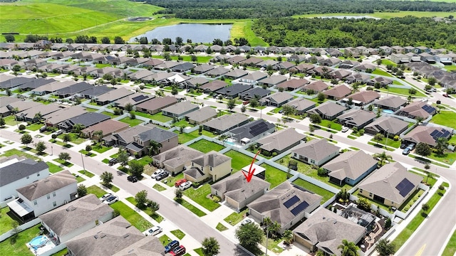14524 Dunrobin Dr, Wimauma, FL 33598 - aerial perspective of suburban area featuring a large body of water