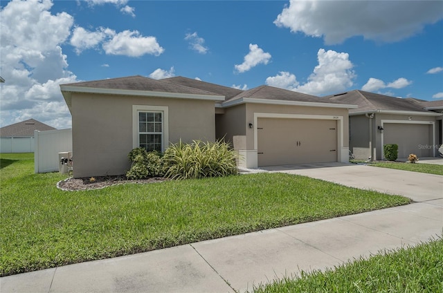 14524 Dunrobin Dr, Wimauma, FL 33598 - single story home featuring stucco siding, an attached garage, concrete driveway, and a front yard