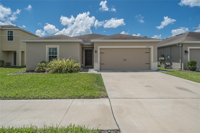 14524 Dunrobin Dr, Wimauma, FL 33598 - view of front of home featuring stucco siding, a garage, a front lawn, and driveway