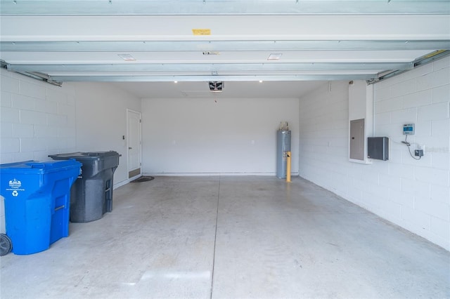 14524 Dunrobin Dr, Wimauma, FL 33598 - garage featuring electric panel, electric water heater, concrete block wall, and a garage door opener