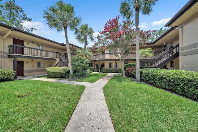 2681 Sabal Springs Cir Unit 204, Clearwater, FL 33761 - view of community featuring stairs and a yard