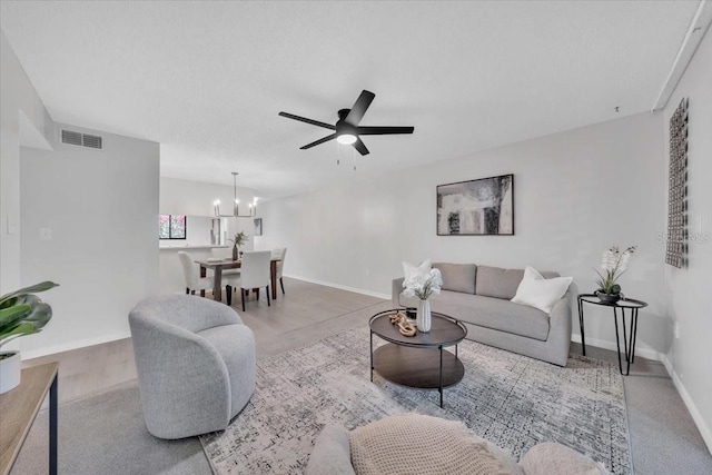 2681 Sabal Springs Cir Unit 204, Clearwater, FL 33761 - living room with a chandelier and ceiling fan