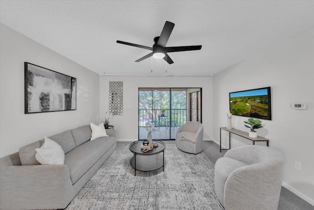 2681 Sabal Springs Cir Unit 204, Clearwater, FL 33761 - living room featuring a ceiling fan and a textured ceiling