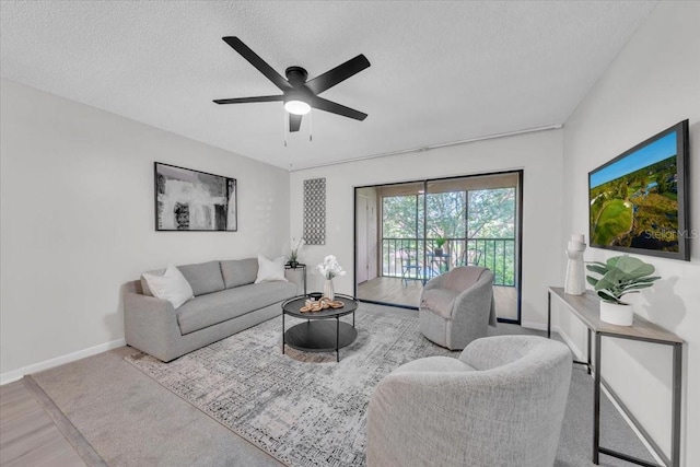 2681 Sabal Springs Cir Unit 204, Clearwater, FL 33761 - living room featuring a textured ceiling, ceiling fan, and wood finished floors