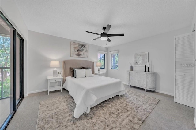 2681 Sabal Springs Cir Unit 204, Clearwater, FL 33761 - carpeted bedroom with a textured ceiling and ceiling fan