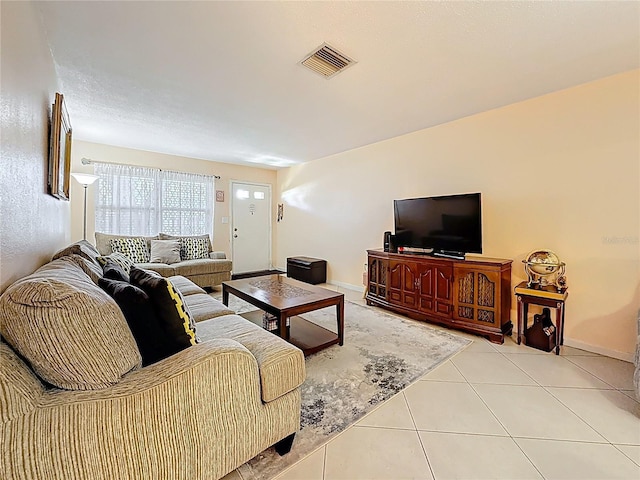 5870 38th Ave N Unit 44, Saint Petersburg, FL 33710 - living area featuring light tile patterned floors and baseboards