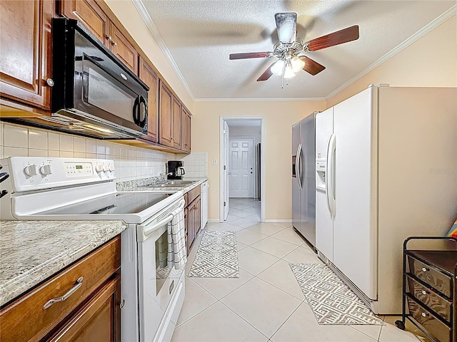 5870 38th Ave N Unit 44, Saint Petersburg, FL 33710 - kitchen featuring white appliances, ornamental molding, brown cabinets, decorative backsplash, and a ceiling fan