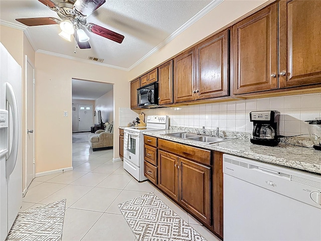 5870 38th Ave N Unit 44, Saint Petersburg, FL 33710 - kitchen with white appliances, ornamental molding, tasteful backsplash, ceiling fan, and light tile patterned floors