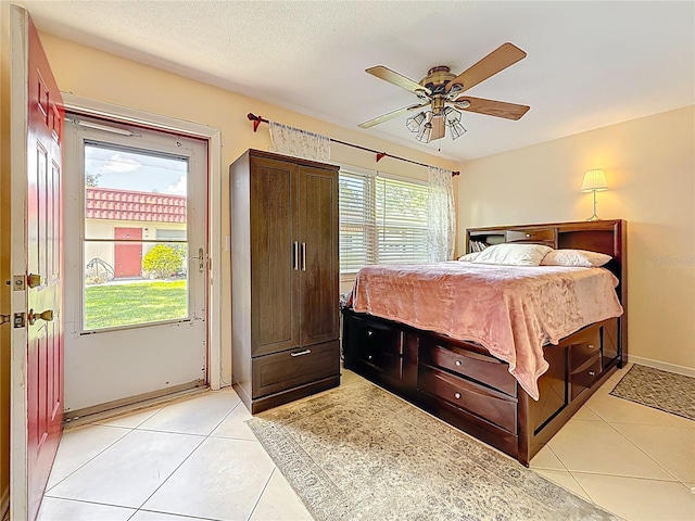 5870 38th Ave N Unit 44, Saint Petersburg, FL 33710 - bedroom featuring light tile patterned floors and ceiling fan