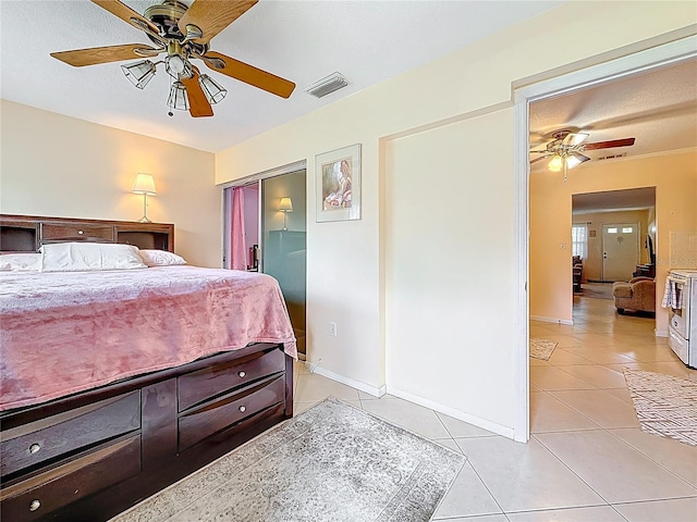 5870 38th Ave N Unit 44, Saint Petersburg, FL 33710 - bedroom featuring light tile patterned floors and a ceiling fan