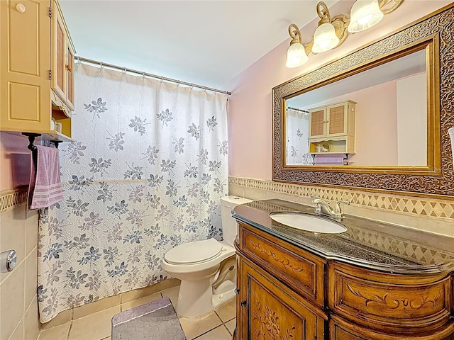5870 38th Ave N Unit 44, Saint Petersburg, FL 33710 - bathroom featuring vanity, tile patterned flooring, tile walls, and a shower with shower curtain