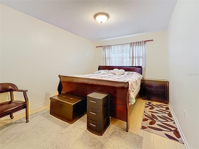 5870 38th Ave N Unit 44, Saint Petersburg, FL 33710 - bedroom with baseboards and a textured ceiling