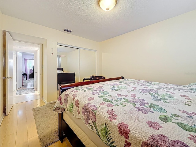 5870 38th Ave N Unit 44, Saint Petersburg, FL 33710 - bedroom featuring a closet and light wood-style flooring