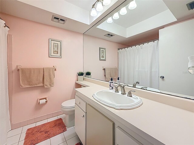 5870 38th Ave N Unit 44, Saint Petersburg, FL 33710 - full bath with tile patterned floors, vanity, a raised ceiling, and a shower with curtain