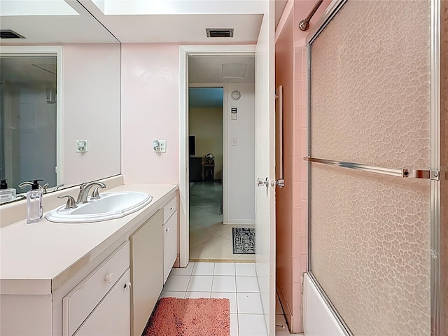 5870 38th Ave N Unit 44, Saint Petersburg, FL 33710 - bathroom with tile patterned flooring, vanity, and shower / bath combination with glass door