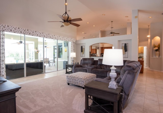 916 Bunker View Dr, Apollo Beach, FL 33572 - living area featuring light tile patterned floors, ceiling fan, high vaulted ceiling, arched walkways, and recessed lighting