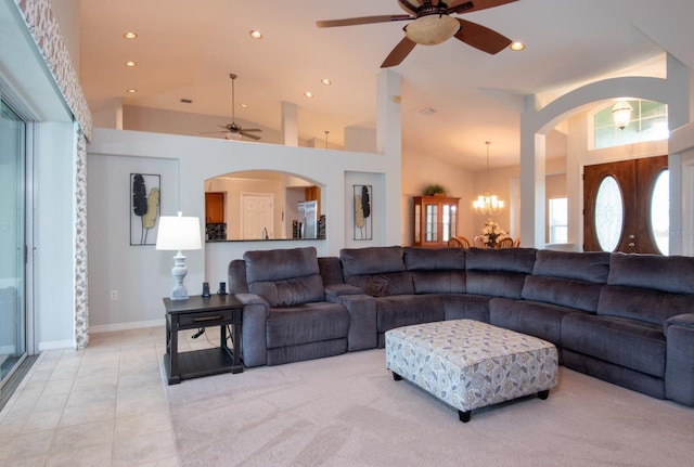 916 Bunker View Dr, Apollo Beach, FL 33572 - living room with ceiling fan, arched walkways, recessed lighting, high vaulted ceiling, and a chandelier