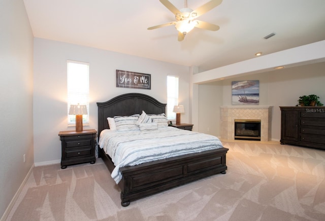 916 Bunker View Dr, Apollo Beach, FL 33572 - bedroom with carpet, a fireplace, and ceiling fan
