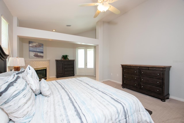 916 Bunker View Dr, Apollo Beach, FL 33572 - bedroom with lofted ceiling, carpet, a fireplace, and a ceiling fan
